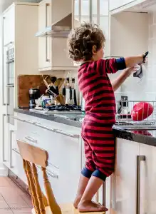 child helping in the kitchen