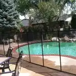 Swimming pool enclosed in fence