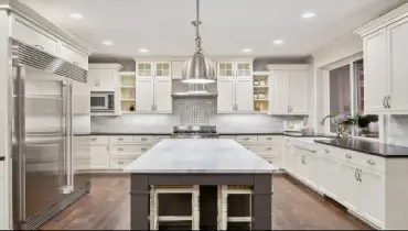 kitchen with island and white cabinets