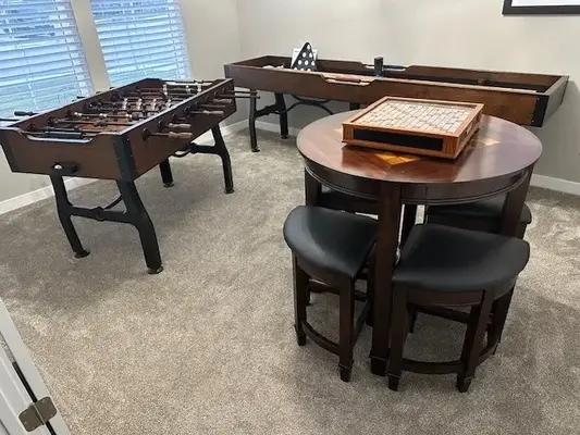 Residential game room with gaming furniture.