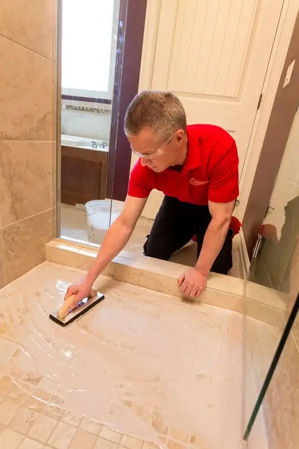 Mr. Handyman technician remodeling shower tile grout in Tulsa, OK home