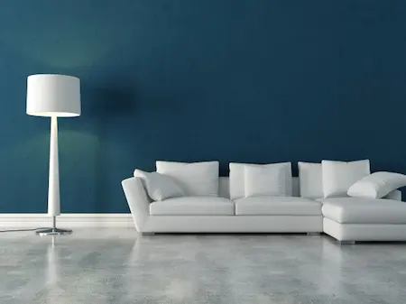 living room with white furniture and blue walls