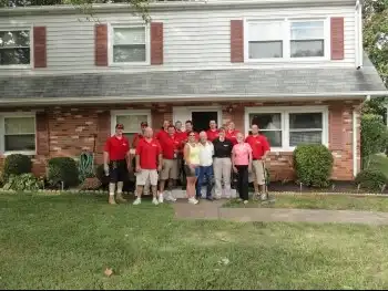 2012 team photo in front of veteran's home for National Day of Service.