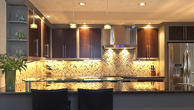 Modern kitchen with a glass-top bar area.