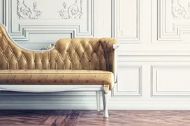 Intricate beadboard behind sofa.