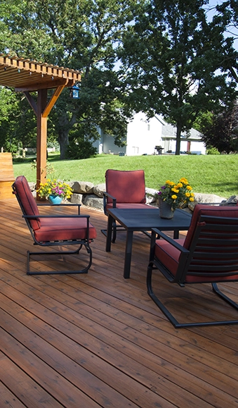 Deck with furniture and pergola.