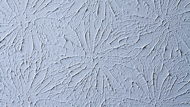 A picture of a ceiling with a textured paint job.