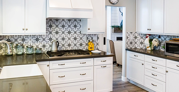 A picture of newly installed white kitchen cabinets.