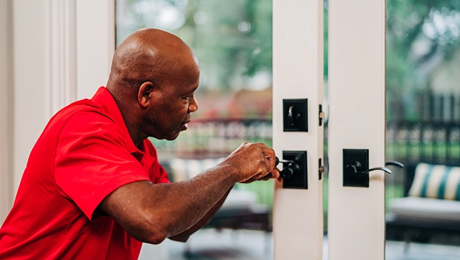 MRH employee repairing a window.