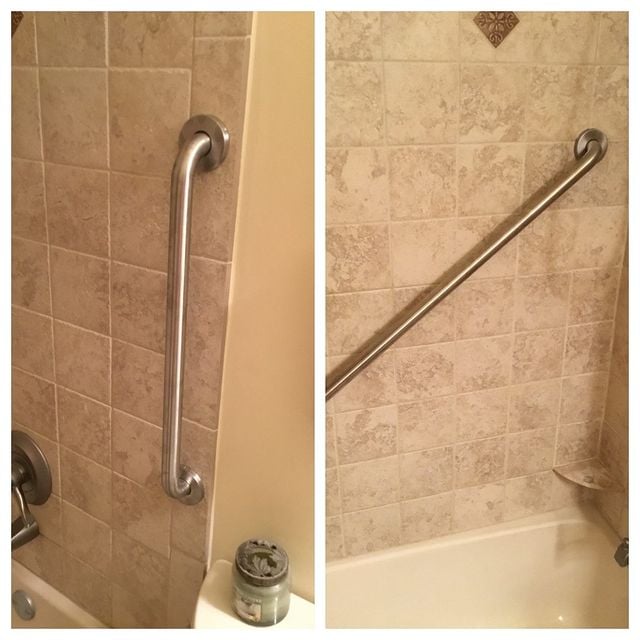 Grab bars installed on brown tile wall in shower