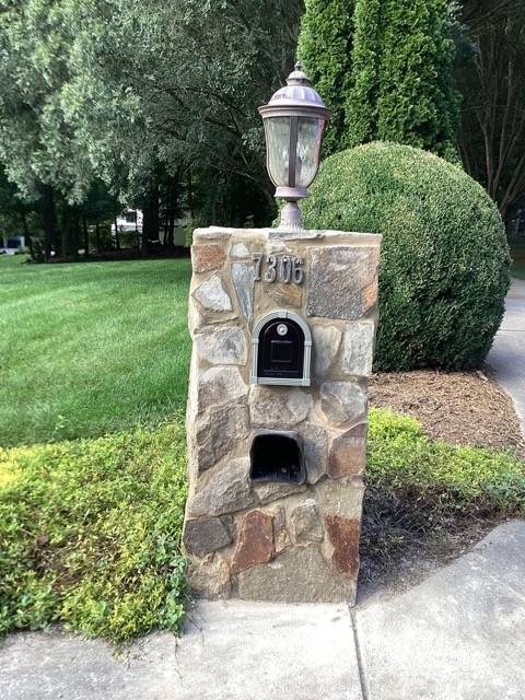 Upgraded stone mailbox with new mailbox insert and top light fixture