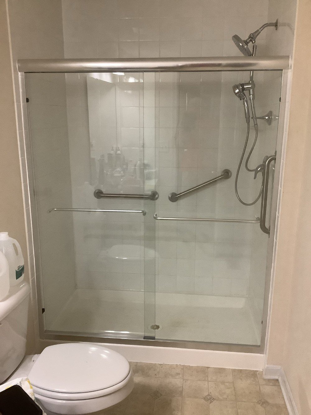 New glass shower doors & grab bars