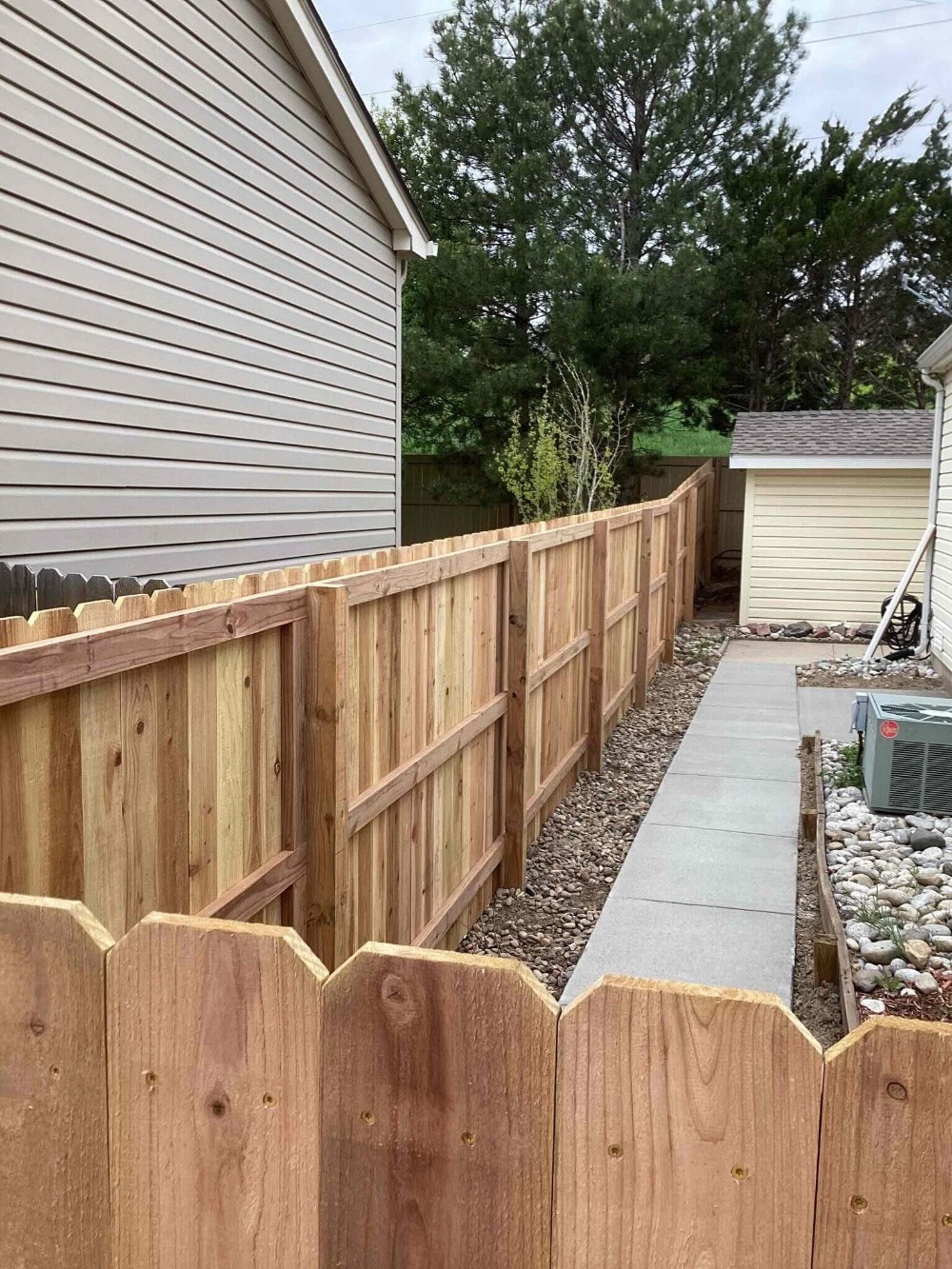 Privacy fence with sidewalk