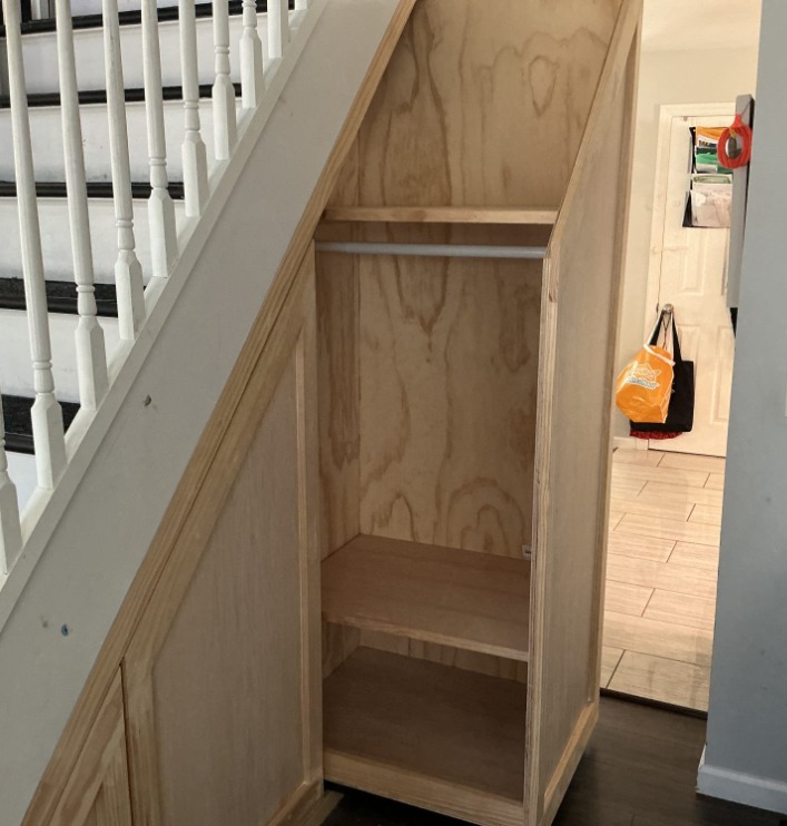 Slide out cubbies under stairs