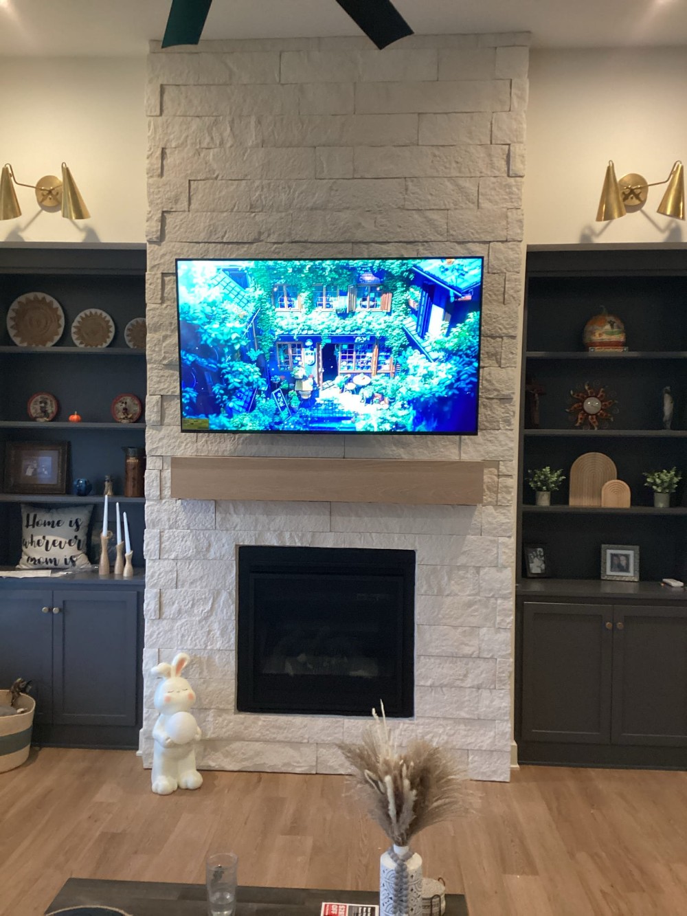 TV Mounted on Stone over Fireplace