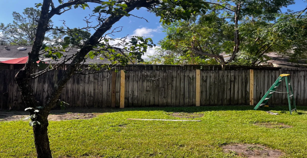 New fence boards installed by Mr. Handyman during fence repair in Richmond, TX