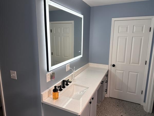 Vanity and mirror installation during a bathroom update in Ann Arbor, MI by My Handyman.