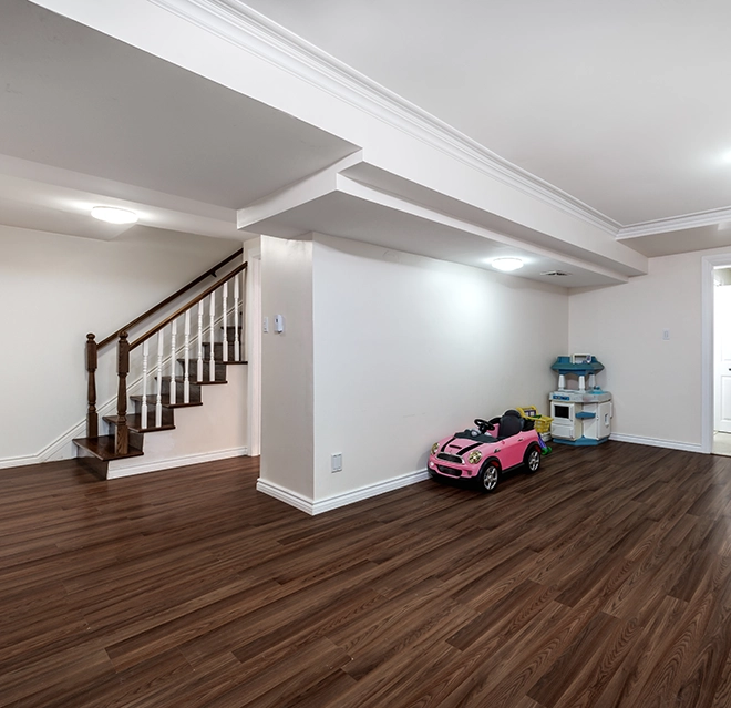 Basement area with wooden flooring.