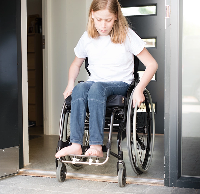 A girl in a wheelchair.