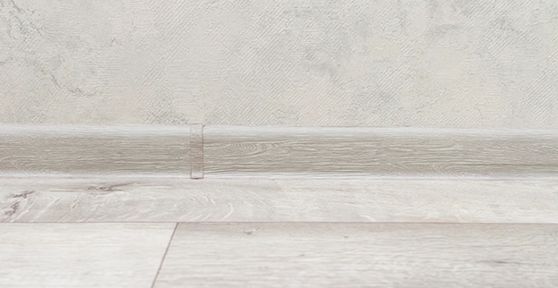 Close-up of light wood flooring along the bottom edge.