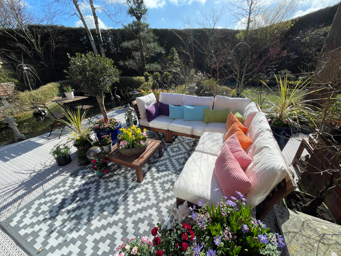 Add an Outdoor Rug for More Space to Relax Outside