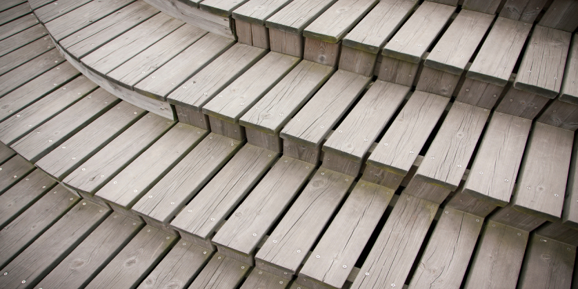An overview shot of deck stairs. Very geometric image with straight, even lines between each deck tread/board.