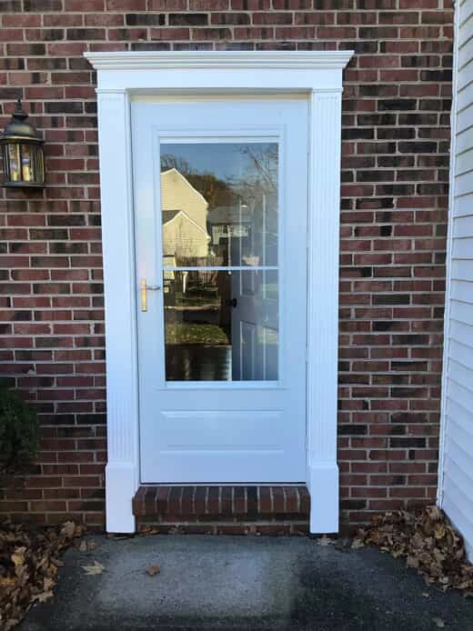 A new storm door installed on the front of a house by the technicians at Mr. Handyman.