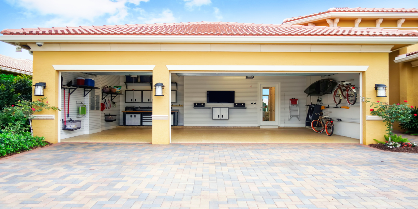 An external shot of a well-organized and clean three car residential garage.