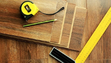 Tools and materials laid out for a professional residential flooring installation project.