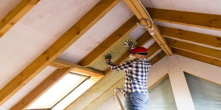Contractor installing attic insulation | Mr. Handyman of Memphis