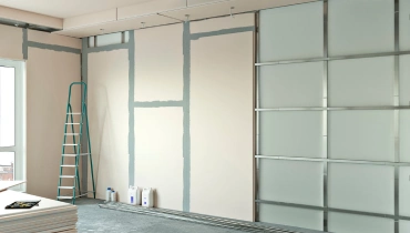 A wall in a residential apartment for which drywall installation is in the process of being completed.