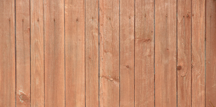 A close up image of wooden fence boards used for fence repair in Frisco, TX.