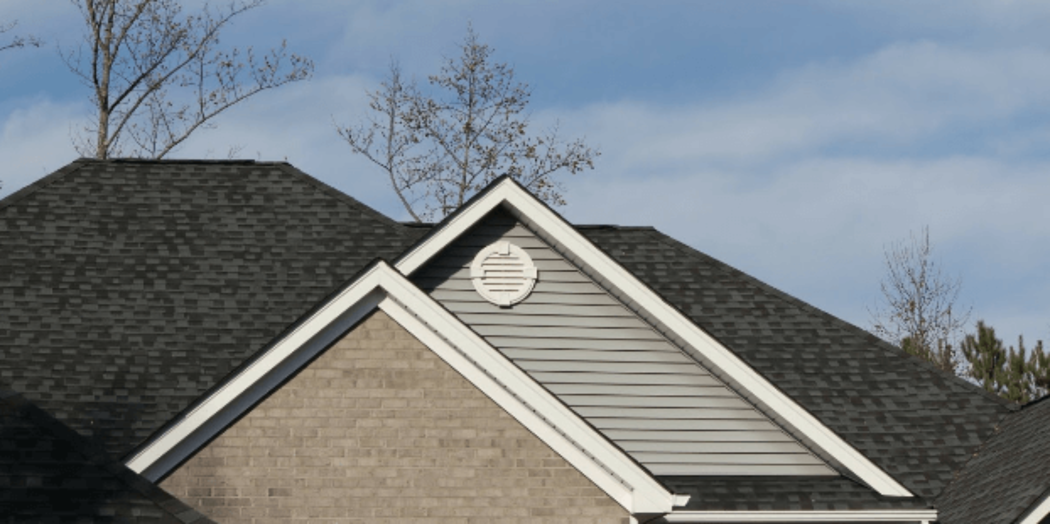 A residential roof with a perfect roofline provided by professional soffit and fascia repair services.