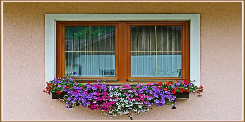 Window decorated with flowers. 