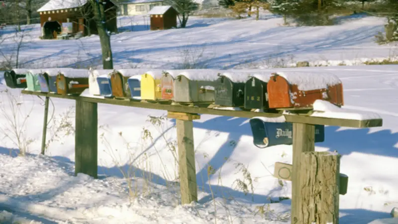 A line of mailboxes in the snow