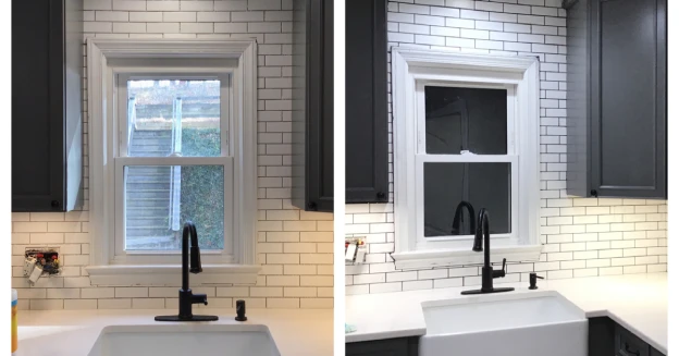 A completed residential kitchen tile backsplash installation project using a pattern of white subway tiles that extends from the countertops to the ceiling.