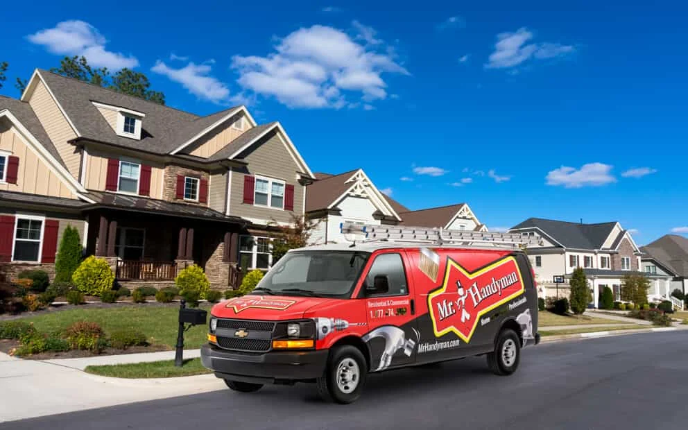 mr handyman van in front of a house