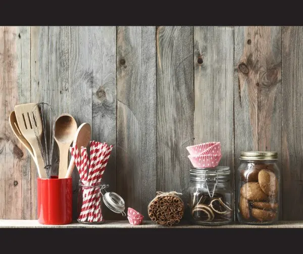 Jars on a shelf filled with items for a kitchen.