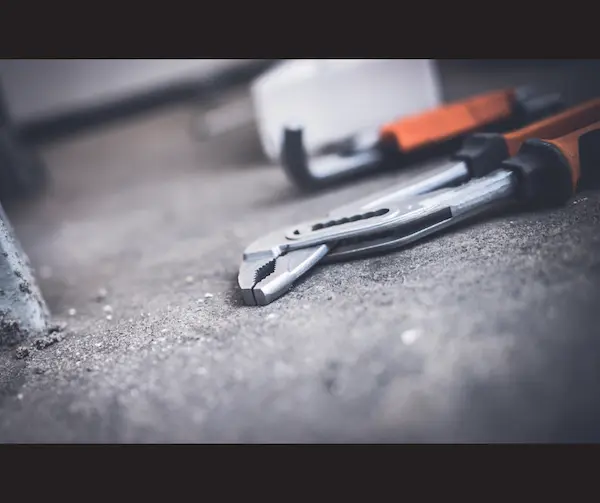 Plier on the cement floor.