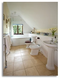 white bathroom with brown tile