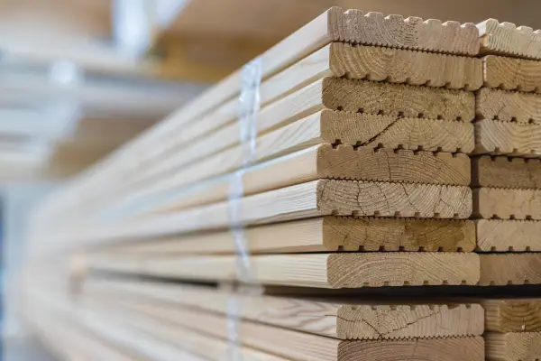 a stack of tied wooden boards for deck materials