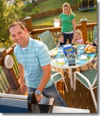 Family barbecuing on their patio