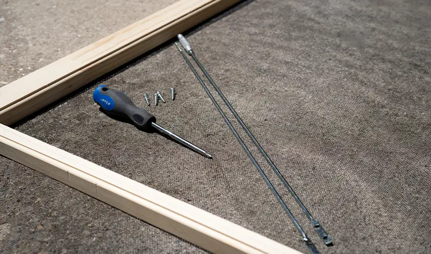 Tools to repair a sagging door.
