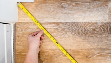 Measuring tape on a wood board