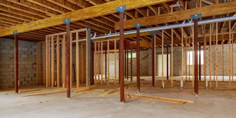 An unfinished residential basement with new wood frames installed for the early stages of a a full remodel.