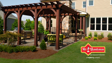 backyard patio cover with green lawn