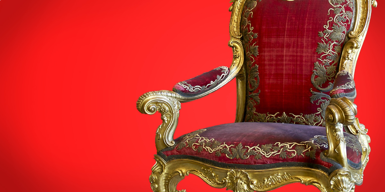 Stuffed chair against a red background