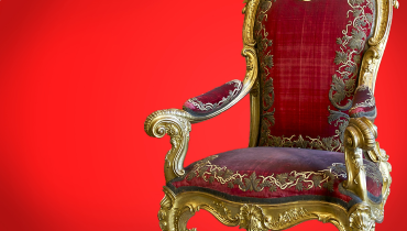 Stuffed chair against a red background