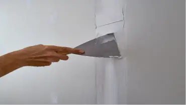 Drywall repair services being rendered for residential home