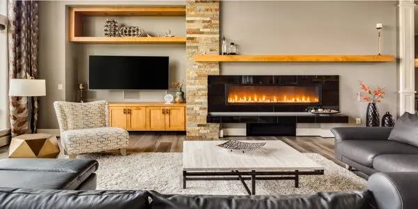 Cozy living room with fireplace and wall mounted TV.